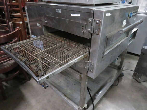 One Lincoln Impinger On A Stainless Steel Stand With SS Under Shelf On Casters. Model# 1132-002-U-K1841. 120/208.Volt. 3 Phase. 57X38X44.5. $15,611.00. - Image 2 of 2