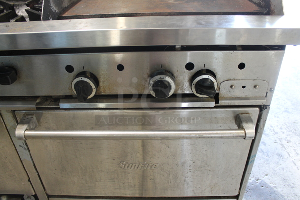 Garland SunFire Stainless Steel Commercial Natural Gas Powered 6 Burner Range w/ Right Side Flat Top Griddle, 2 Ovens, Over Shelf and Back Splash.  - Image 4 of 9