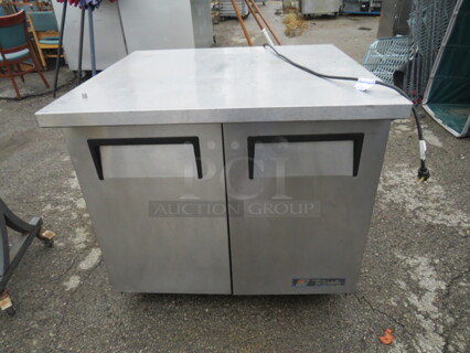 One WORKING True 2 Door Work Top Refrigerator With 2 Racks On Casters. 115 Volt. Model# TUC-36-34. 36X34X34