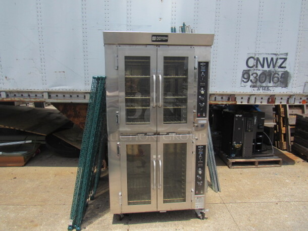 One Doyon Double Stack Convection Oven With 6 Racks On Casters. Model# JA14. 120/208 Volt. 3 Phase. Missing Left Side Panel. 38X36X73