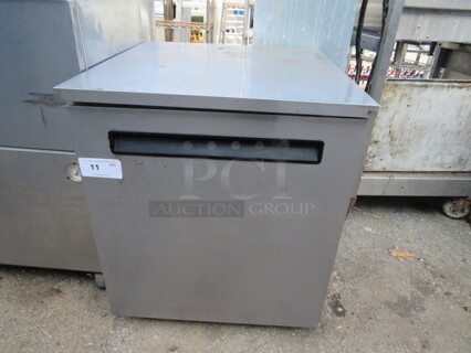 One Delfield 1 Door Enodis Freezer With 1 Rack On Casters. Model# 406-STAR2. 27X28.5X32