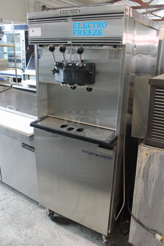 Electro Freeze Stainless Steel Commercial Water Cooled 2 Flavor w/ Twist Soft Serve Ice Cream Machine on Commercial Casters. 230 Volts, 1 Phase.
