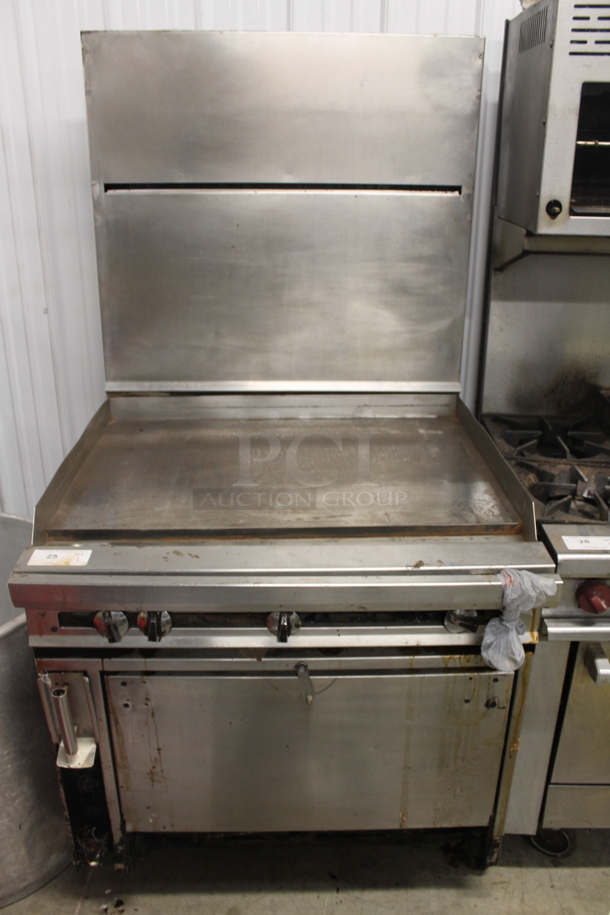 Jade Range Commercial Stainless Steel Natural Gas Powered Griddle Range With CONVECTION Oven With Pan Racks On Commercial Casters.