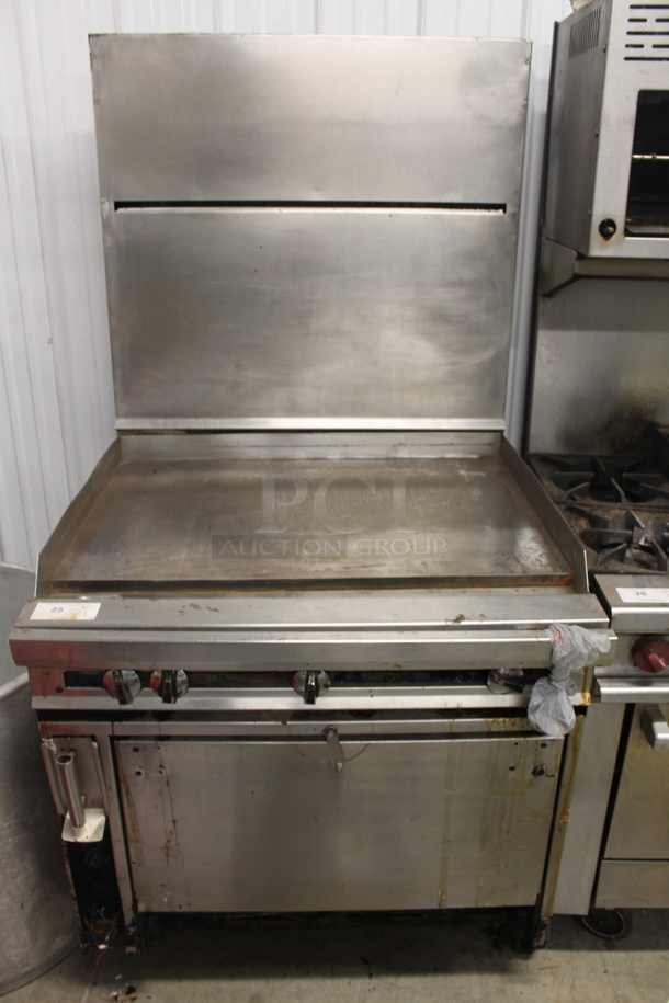 Jade Range Commercial Stainless Steel Natural Gas Powered Griddle Range With CONVECTION Oven With Pan Racks On Commercial Casters. - Image 1 of 10