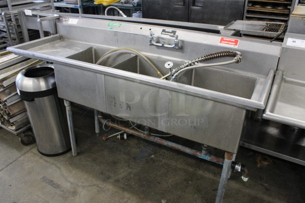 Stainless Steel Commercial 3 Bay Sink w/ Left Side Drainboard, Handles and Spray Nozzle Attachment. 76x24x44. Bays 18x18x12. Drainboard 16x21x1
