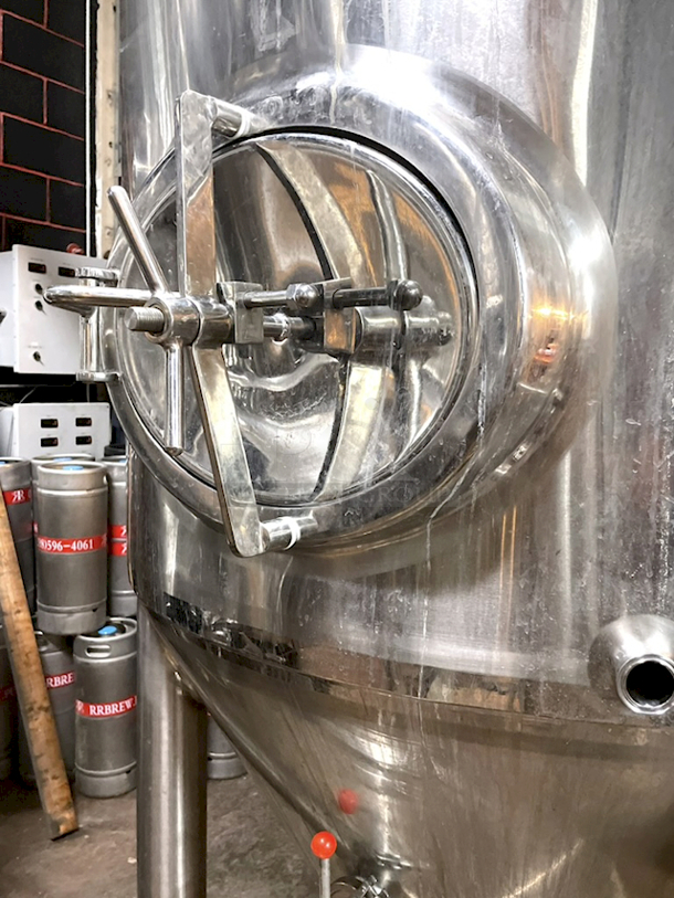 ? ? BEAUTIFUL!! Stout Tanks & Kettles - 15 BBL Fermenter / Unitank (Jacketed). ? ? Features: Easily Converts to a Unitank or Brite Serving Tank; Glycol Jacketed - 2 Zones: Cone and Sidewall; Shadowless Manway for Easy Cleaning; Adjustable Racking Arm for Clear Transfer; 1.5" Sample Valve for Quality Testing; Back Mounted Pressure Gauge; Adjustable Feet for Leveling on Uneven Floors or Fine Height Adjustments; Pressure Gauge Type: Back Mount; CIP Arm and 2.5" Rotating CIP Spray Ball; 2 Butterfly Valves; Rated to 2-Bar (29 PSI); 1/2" NPT Welded Thermowell for Contactless Temperature Probe Tank Thickness: 3mm Jacket and Outer Shell Thickness: 2mm. Cone: 60 degree Interior Angle. 51.5-in. diameter x 125-in.H. - Image 3 of 4