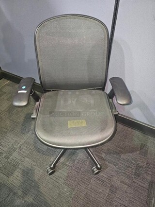 Black office/ desk chair made by Knoll. Features breathable fabric, armrests and has a black metal frame on wheels. In good used condition with signs of use and some scratches but a great chair from a well-known brand. Measures 40” H x 26.5” W. 

