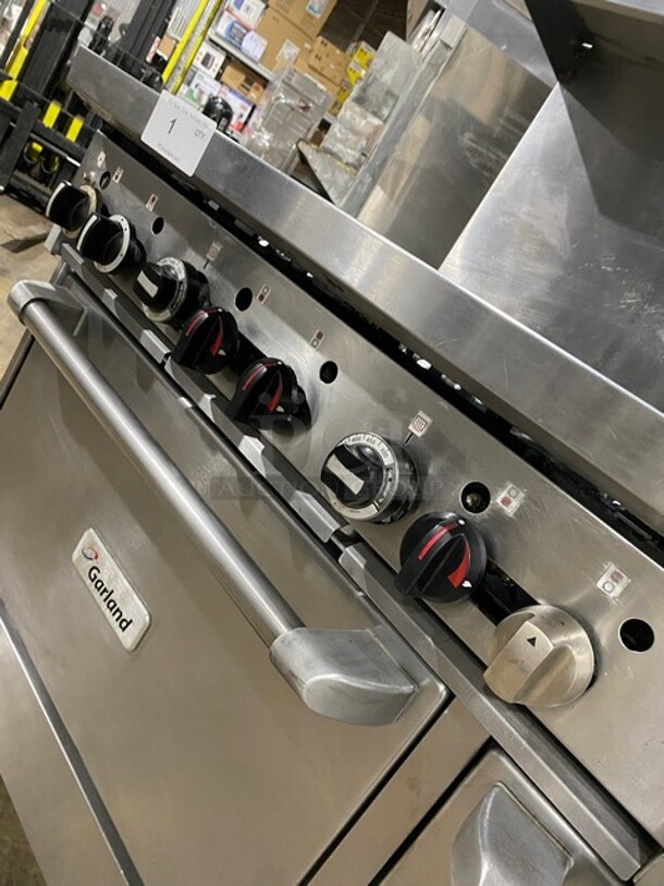 WOW! Garland Stainless Steel Commercial Natural Gas Powered! 6 Burner Range With Right Side Flat Top Griddle, 2 Ovens, Back Splash! On Casters! Working When Removed! MODEL GFE606R24RR SM:GFE606R24RR0009 - Image 6 of 9