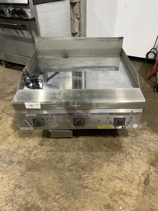 BRAND NEW! OUT OF THE BOX! Garland Commercial Natural Gas Powered Countertop MIRROR SHINE Flat Griddle! With Thermostatic Controls! With Back & Side Splash! All Stainless Steel! On Legs!