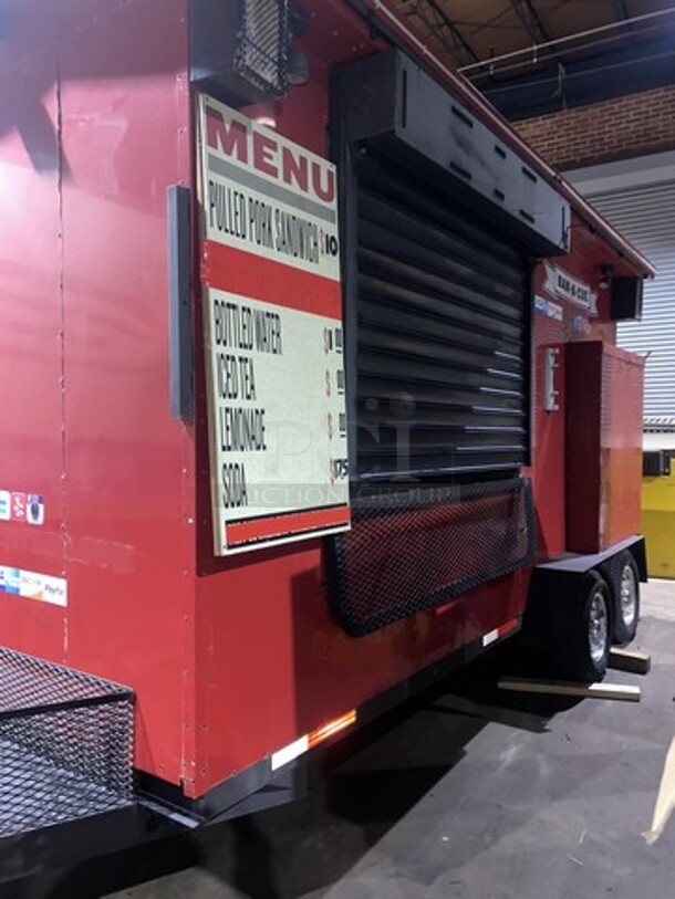 SPECTACULAR! BE YOUR OWN BOSS!!! LANG Nicely Equipped BBQ Food Trailer! Equipped With True GDM 40 2 Door Reach In Cooler, All Stainless Steel 3 Compartment Sink With Water Tanks,  Stainless Steel Hand Wash Sink, American Range Majestic LP Powered Convection Oven, Duke 3 Well Electric Powered Steam Table With Custom Folding Custom Poly Cutting Board, Poly Top Work Table With Storage Space, All Stainless Steel 2 Door Wall Storage Cabinet, Exhaust Fan, Sony LCD Menu Board, Hydraulic Lift Roof Sign, Entertainment System/Speakers! HIGH Ceilings & Diamond Plated Floor! Front Gate & Back Door With Locks! Flood Lights & Menu Boards! Food Box Trailer Is 15 Feet By 6 Feet By 9.5 Feet High! With Additional 4 Feet Front Trailer Storage & Hitch!  READY FOR WORK!!!!     - Image 9 of 12