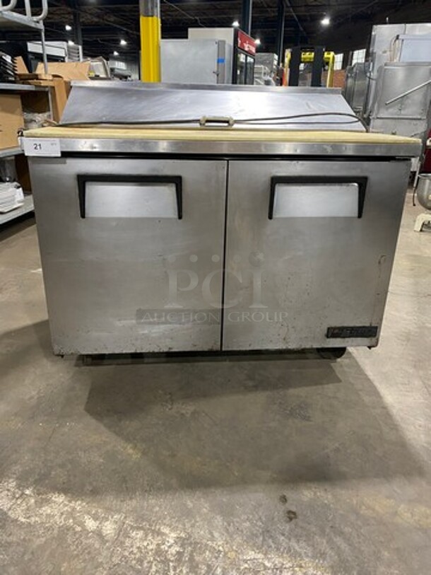 True Commercial Refrigerated Sandwich Prep Table! With Commercial Cutting Board! With 2 Door Underneath Storage Space! Poly Coated Racks! All Stainless Steel! On Casters! Model: TSSU4812 SN: 5272423 115V 60HZ 1 Phase