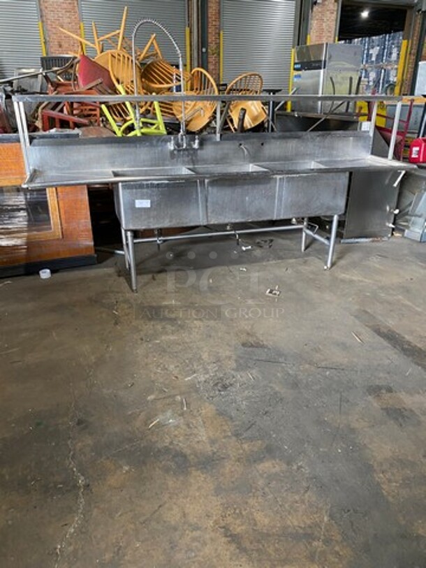 Commercial 3 Compartment Dish Washing Sink! With Overhead Shelf! With Jet Spray Assembly! With Dual Side Drain Board! With Back Splash! All Stainless Steel! On Legs! - Image 1 of 9