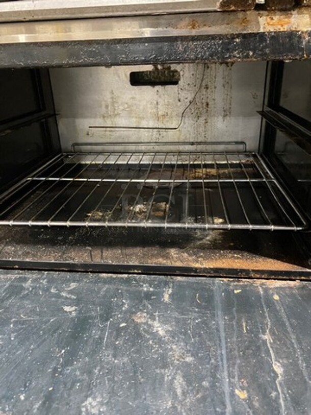 American Range Commercial Natural Gas Powered 10 Burner Stove! With Raised Back Splash And Salamander Shelf! With 2 Full Size Oven Underneath! Metal Oven Racks! All Stainless Steel! On Casters! - Image 6 of 12