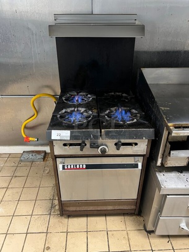 Garland Commercial Natural Gas Powered 4 Burner Stove! With Raised Back Splash And Salamander Shelf! With Oven Underneath! Metal Oven Rack! All Stainless Steel! On Legs! WORKING WHEN REMOVED!