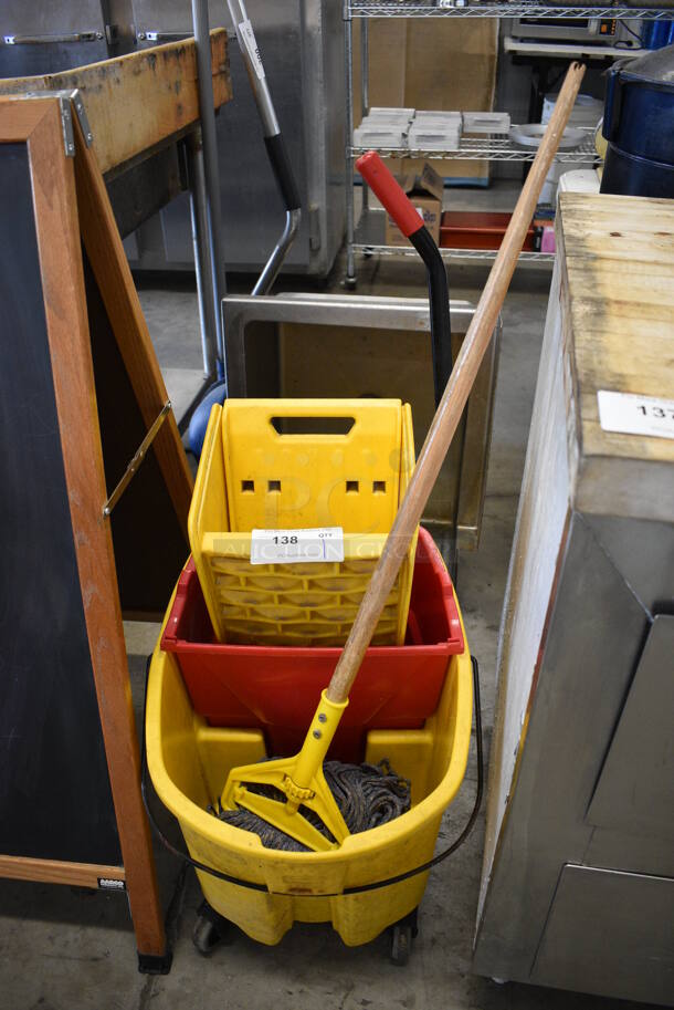 Yellow Poly Mop Bucket w/ Mop and Wringing Attachment on Commercial Casters. 15.5x21.5x36