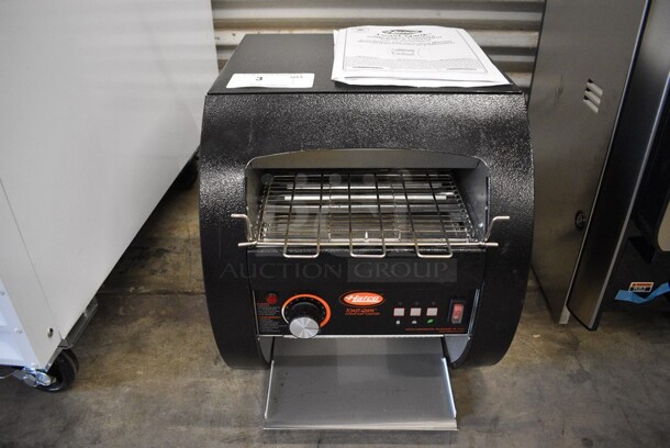 BRAND NEW SCRATCH AND DENT! Hatco Model TQ3-10 Metal Commercial Countertop Electric Powered Toast-Qwik Conveyor Toaster Oven. Unit Was Only Used For Trade Show Demonstrations. 120 Volts, 1 Phase. 14.5x19.5x16. Tested and Working!