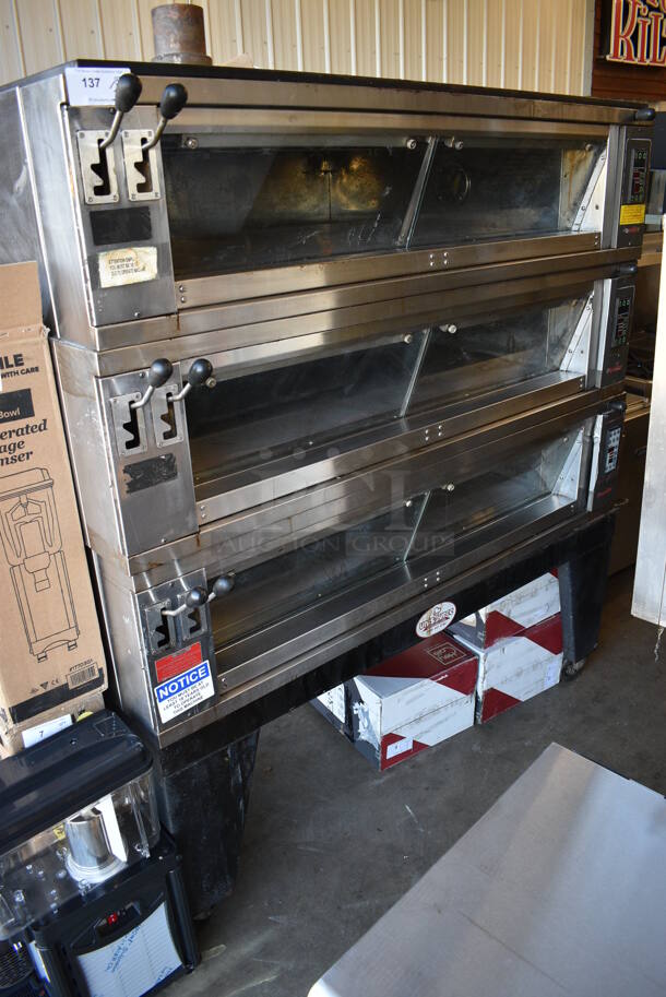 Pavailler Stainless Steel Commercial Electric Powered 3 Deck Digital Steam Artisan Brick Oven Pizza Oven on Metal Legs. Appears To Be Model Rubis 4B. 208-220 Volts, 3 Phase. 67x56x74