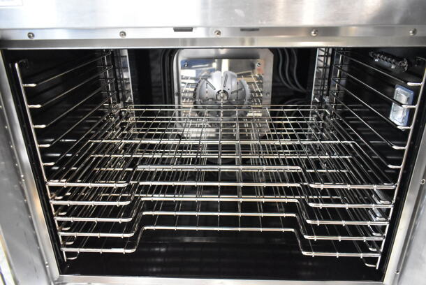 BRAND NEW SCRATCH AND DENT! Vulcan VC4ED ENERGY STAR Stainless Steel Commercial Electric Powered Full Size Convection Oven w/ View Through Doors, Metal Oven Racks and Thermostatic Controls. 480 Volts, 3/1 Phase. No Legs.  - Image 4 of 5