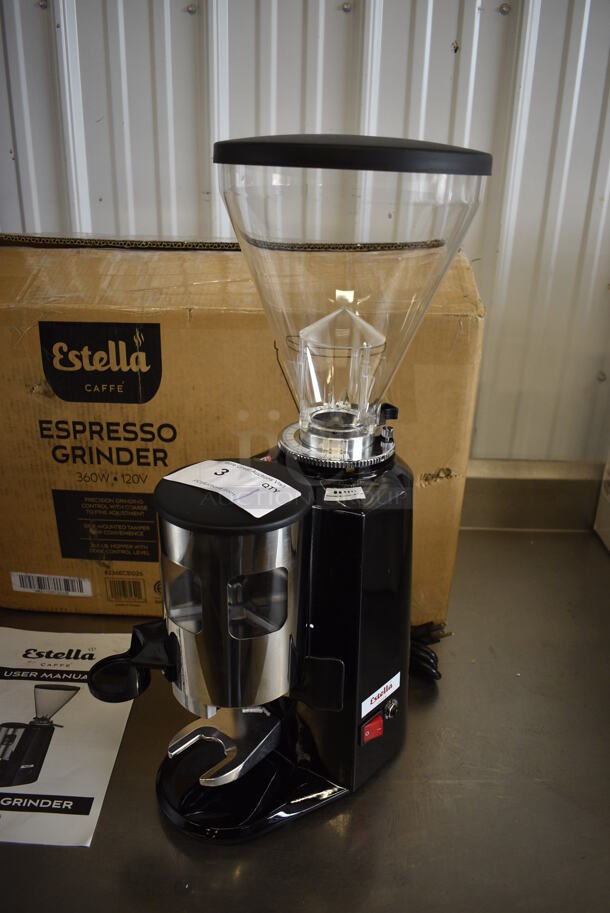 BRAND NEW IN BOX! Estella Model 236ECEG26 Metal Commercial Countertop Espresso Bean Grinder w/ Hopper. Unit Was Only Used as a Demonstration at Trade Shows. 110/120 Volts, 1 Phase. 9x14x22. Tested and Working!