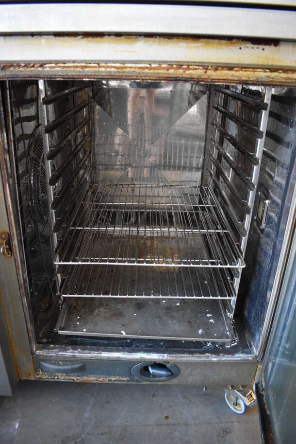 2 2016 Rational Stainless Steel Commercial Combitherm Self Cooking Center Convection Ovens on Commercial Casters. Top Model: SCC WE 62. Bottom Model: SCC WE 102. 480 Volts, 3 Phase. Picture of the Unit Before Removal Is Included In the Listing. 42x41x73. 2 Times Your Bid!  - Image 5 of 11