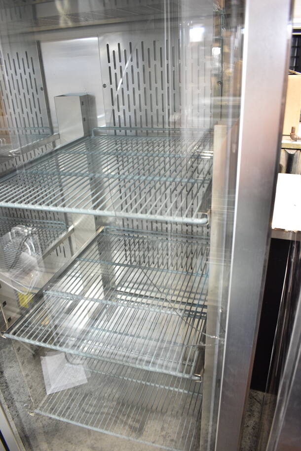 BRAND NEW SCRATCH AND DENT! 2023 Avantco 178Z2RGHC Stainless Steel Commercial 2 Door Reach In Cooler Merchandiser w/ Poly Coated Racks on Commercial Casters. See Pictures for Crack in Right Door. 115 Volts, 1 Phase. Tested and Powers On But Does Not Get Cold - Image 4 of 7