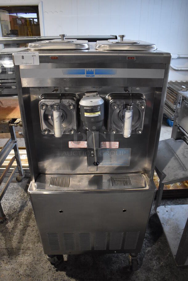 2013 Taylor 342D-27 Stainless Steel Commercial Floor Style Air Cooled 2 Flavor Frozen Beverage Machine w/ Drink Mixer Attachment on Commercial Casters. 208-230 Volts, 1 Phase. 27.5x33x60