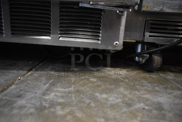 2014 Delfield 4427N-12M Stainless Steel Commercial Prep Table on Commercial Casters. 115 Volts, 1 Phase. Tested and Powers On But Does Not Get Cold
 - Image 4 of 5
