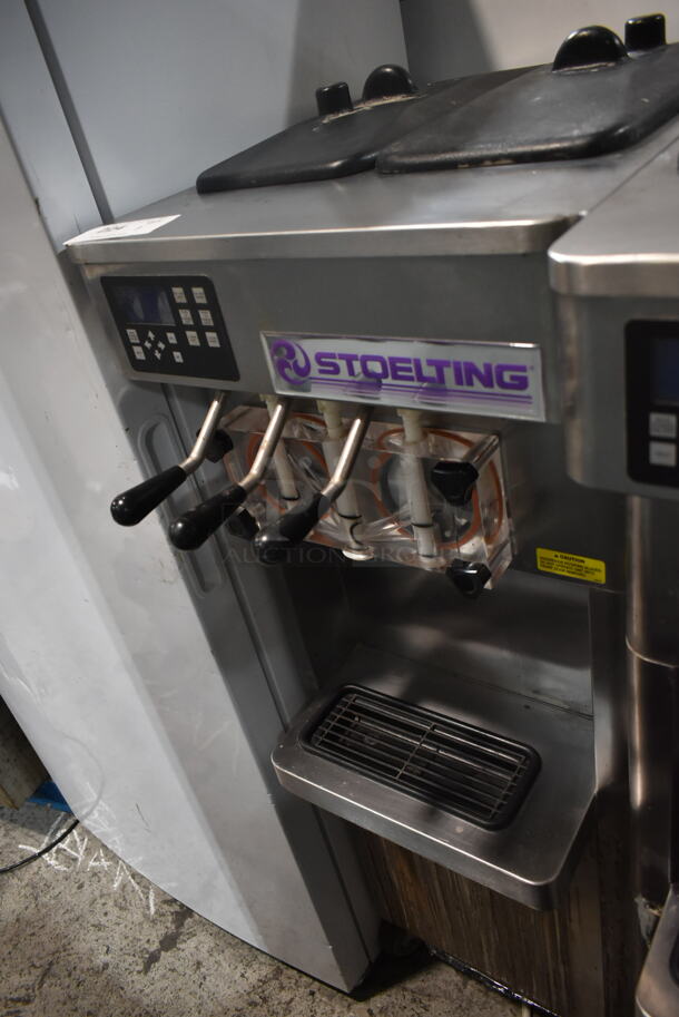 2014 Stoelting F231-18I2-SFAD Stainless Steel Commercial Floor Style Water Cooled 2 Flavor w/ Twist Soft Serve Ice Cream Machine on Commercial Casters. 208-240 Volts, 1 Phase. - Item #1109501