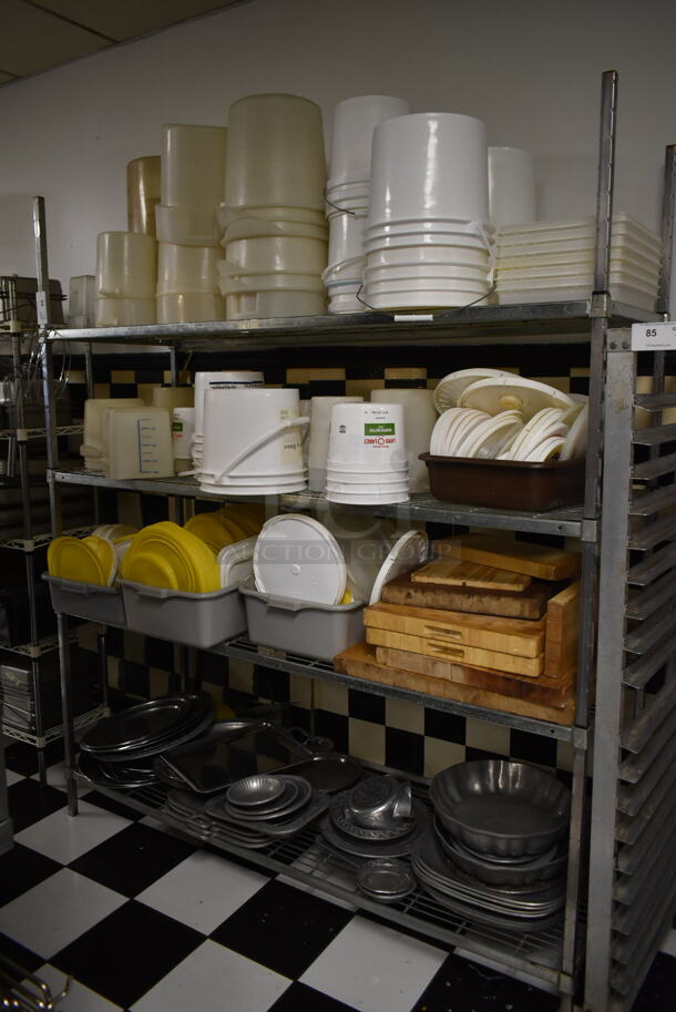 Chrome Finish 4 Tier Wire Shelving Unit w/ Contents Including Poly Bins and Metal Bowls. BUYER MUST REMOVE: BUYER MUST DISMANTLE. PCI CANNOT DISMANTLE FOR SHIPPING. PLEASE CONSIDER FREIGHT CHARGES. (kitchen #2) - Image 1 of 5