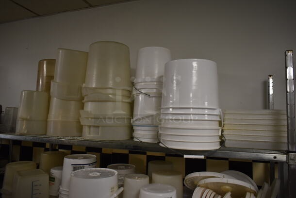 Chrome Finish 4 Tier Wire Shelving Unit w/ Contents Including Poly Bins and Metal Bowls. BUYER MUST REMOVE: BUYER MUST DISMANTLE. PCI CANNOT DISMANTLE FOR SHIPPING. PLEASE CONSIDER FREIGHT CHARGES. (kitchen #2) - Image 2 of 5