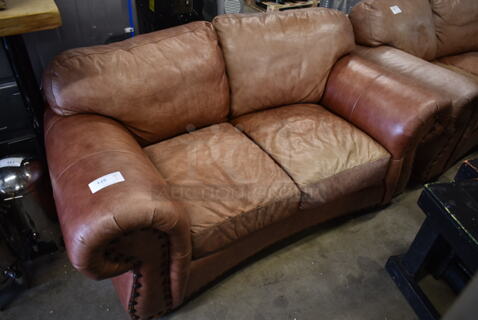 Brown 2 Seat Couch w/ Arm Rests.