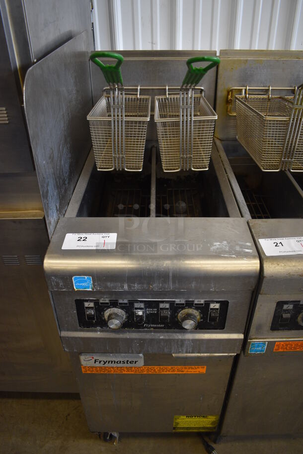 2012 Frymaster Model PH155-2SC ENERGY STAR Stainless Steel Commercial Floor Style Natural Gas Powered Deep Fat Fryer w/ 2 Metal Fry Baskets and Left Side Splash Guard on Commercial Casters. 40,000 BTU. 15.5x30x46