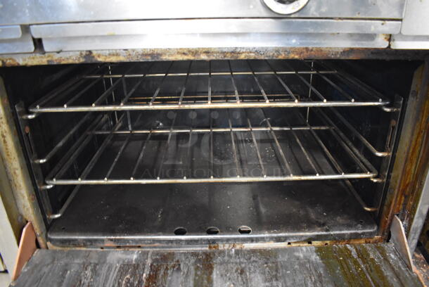 Garland Stainless Steel Commercial Natural Gas Powered 6 Burner Range w/ Flat Top Griddle, 2 Ovens, Over Shelf and Back Splash. 60x35x59.5 - Image 8 of 9