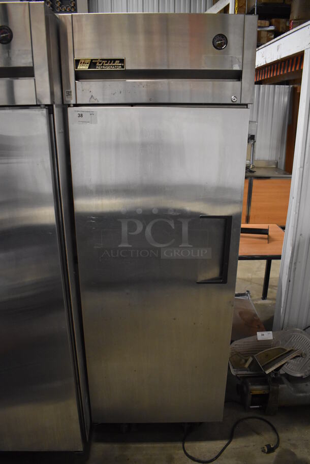 2011 True TG1R-1S Stainless Steel Commercial Single Door Reach In Cooler w/ Poly Coated Racks on Commercial Casters. 115 Volts, 1 Phase. 29x35x83. Tested and Working!