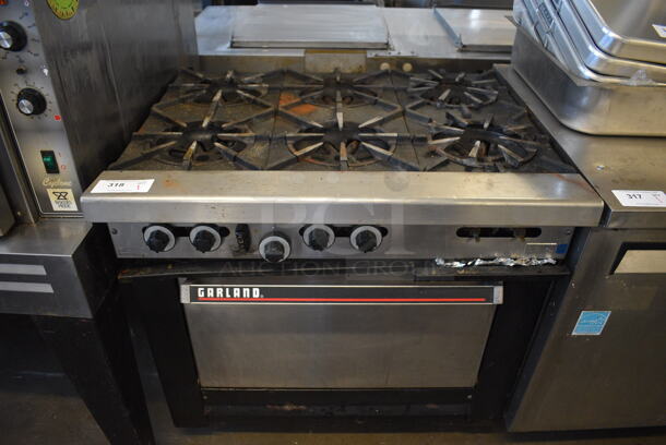 Garland Stainless Steel Commercial Natural Gas Powered 6 Burner Range w/ Oven. 36x33x38
