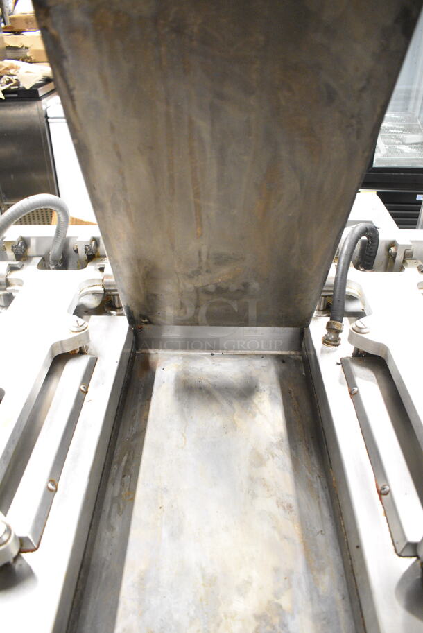 2015 Garland XG36 Stainless Steel Commercial Floor Style Natural Gas Powered  Xpress 36" Semi Automatic Triple Clamshell Grill Griddle on Commercial Casters.   - Image 4 of 12