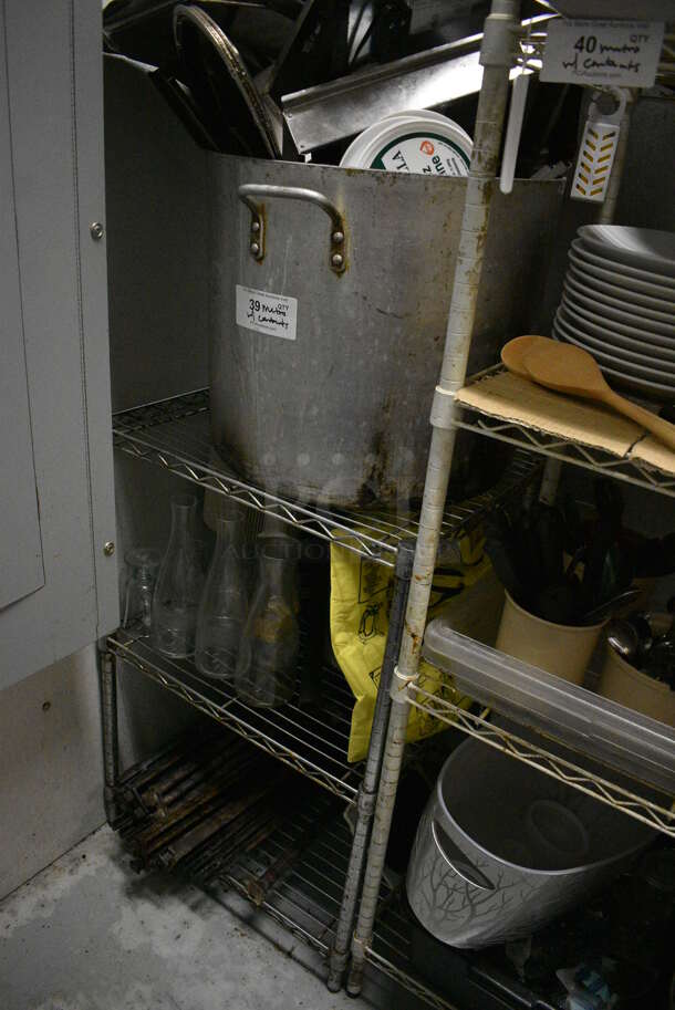 Chrome Finish 3 Tier Shelving Unit w/ Contents Including Metal Stock Pot, Bottles and Burners. 24x18x36. BUYER MUST REMOVE. BUYER MUST DISMANTLE. PCI CANNOT DISMANTLE FOR SHIPPING. PLEASE CONSIDER FREIGHT CHARGES. (kitchen) - Image 1 of 5