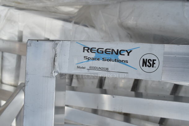 4 BRAND NEW SCRATCH AND DENT! Items; 1 White Resin Chaise Lounger and 3 Aluminum Dunnage Racks Including Regency 600DUN2036, Regency 600DUN1448, Regency 600DUN122060. See Pictures For Damage. 4 Times Your Bid! - Image 3 of 12