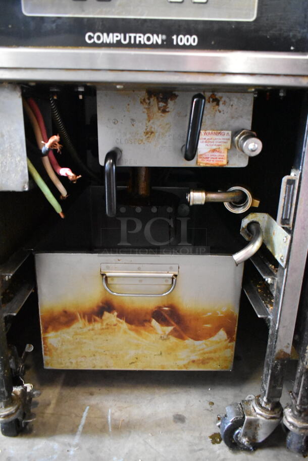 Henny Penny 500 Stainless Steel Commercial Floor Style Electric Powered Pressure Fryer w/ Metal Fry Basket on Commercial Casters. 208 Volts, 3 Phase.  - Image 6 of 7