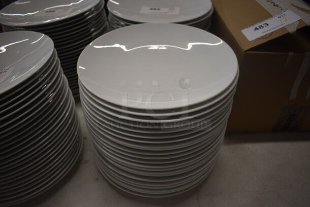 24 White Ceramic Plates. 10.75x10.75x1. 24 Times Your Bid!