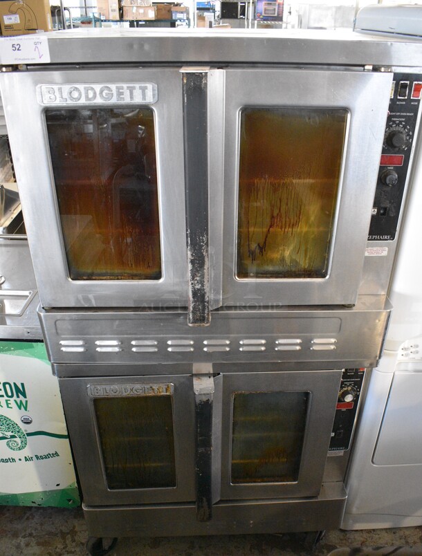 2 Blodgett Zephaire-200-G Stainless Steel Commercial Natural Gas Powered Full Size Convection Ovens w/ View Through Doors, Metal Oven Racks and Thermostatic Controls on Commercial Casters. 39x37x71. 2 Times Your Bid!