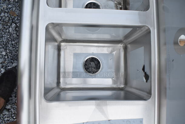 BRAND NEW SCRATCH AND DENT! Regency 600S21014216 54" 16-Gauge Stainless Steel Two Compartment Commercial Sink with Galvanized Steel Legs and Two Drainboards - 10" x 14" x 12" Bowls. No Legs.  - Image 6 of 9