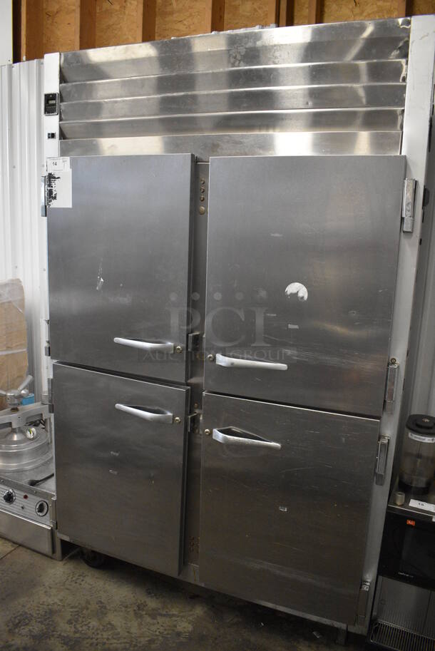 Traulsen Model G20000MC Stainless Steel Commercial 4 Half Size Door Reach In Cooler w/ Poly Coated Racks on Commercial Casters. 115 Volts, 1 Phase. 52x35x84. Tested and Working!