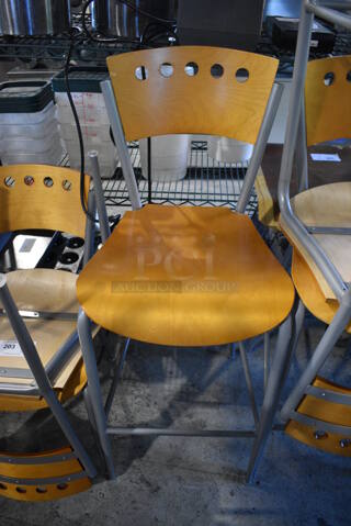 2 Wooden Bar Height Chairs on Gray Metal Frame. Stock Picture - Cosmetic Condition May Vary. 17x16x43. 2 Times Your Bid!