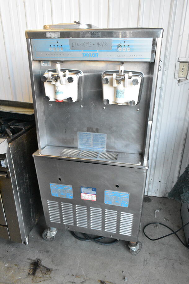 Taylor 755-27 Stainless Steel Commercial 2 Flavor w/ Twist Soft Serve Ice Cream Machine on Commercial Casters. 208-230 Volts, 1 Phase.  - Image 1 of 8