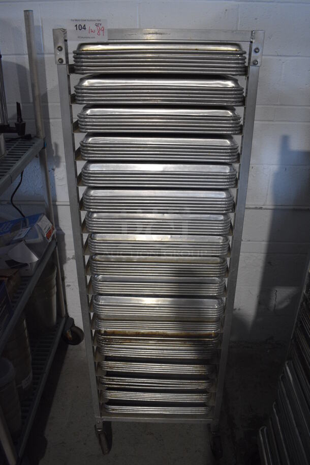 Metal Commercial Pan Transport Rack on Commercial Casters w/ 89 Metal Full Size Baking Pans. 20.5x26.5x63. Pans 18x26x1