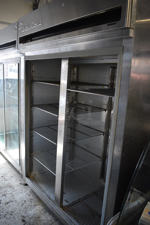 Delfield Model MRR2-SL Stainless Steel Commercial 2 Door Reach In Cooler w/ Metal Racks on Commercial Casters. Missing Doors. 115 Volts, 1 Phase. 56x34x79. Tested and Working!