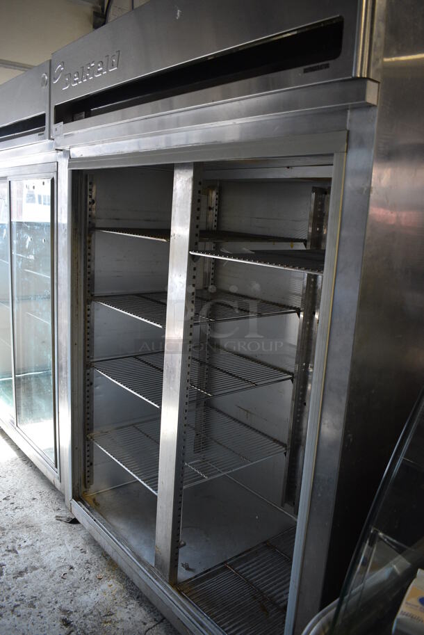 Delfield Model MRR2-SL Stainless Steel Commercial 2 Door Reach In Cooler w/ Metal Racks on Commercial Casters. Missing Doors. 115 Volts, 1 Phase. 56x34x79. Tested and Working! - Image 1 of 5