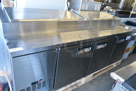 BRAND NEW SCRATCH AND DENT! 2024 Avantco 178APPT91HC Stainless Steel Commercial 3 Door Refrigerated Pizza Prep Table. 115 Volts, 1 Phase. Tested and Working!