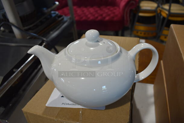 4 BRAND NEW IN BOX! White Ceramic Tea Pots. 9x5.5x5. 4 Times Your Bid!